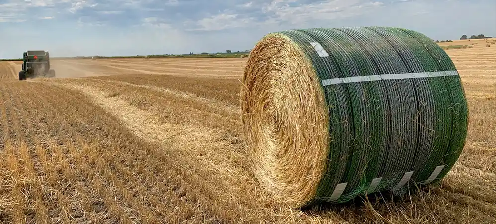 B wrap net on the bale in the the field